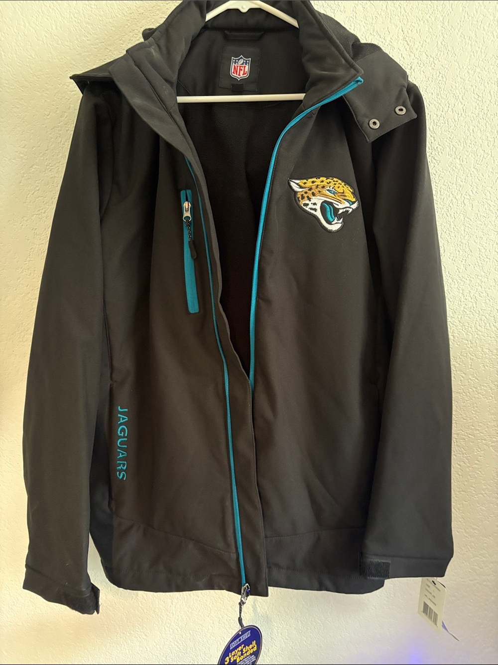 NFL Jacksonville Jaguars Black Jacket with Teal Trim